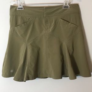 ATHLETA All Terrain Pleated Tennis Skirt in Olive.